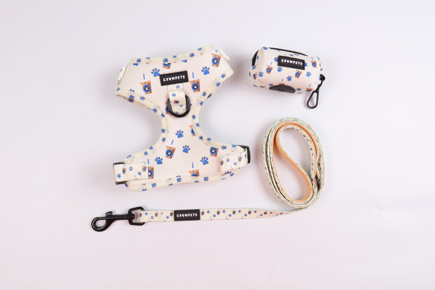 Crumpets Boutique - Treat your precious fur baby to walkies in café-chic fashion with our Puppachino bundle. The set includes a harness, lead, and waste bag holder sporting a delightful coffee cup pattern.